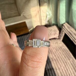 1.5 CTTW Three stone diamond engagement ring/platinum setting